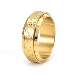 Close-up of golden spinner ring with Celtic knot patterns and Nordic rune engravings