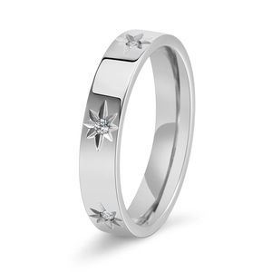 Macro detail of silver steel ring featuring three engraved starbursts with tiny zircons