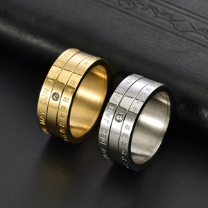 Rotating stainless steel calendar ring with crystal inlay in gold and silver finish