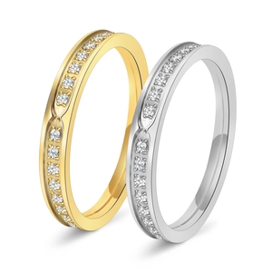 Gold and silver minimalist stainless steel rings set with channel-set cubic zirconia stones