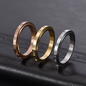 Rotating 18K gold plated eternity band set with small square diamonds on black leather