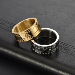 Rotating stainless steel calendar ring with crystal inlay in gold and silver finish