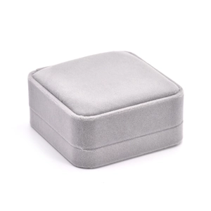 Elegant grey velvet jewelry gift box for rings and pendants on a white background