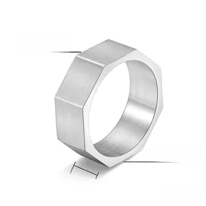Macro detail of 8mm brushed titanium steel octagonal ring with industrial finish