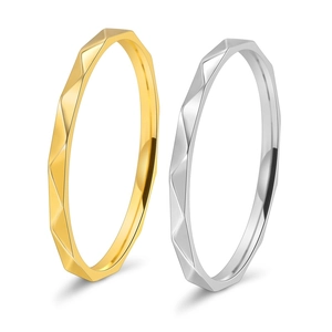Minimalist V-shaped 18K gold and silver faceted geometric rings with a polished finish