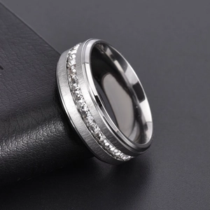 Fashionable titanium steel ring with a single row of square diamonds on black leather