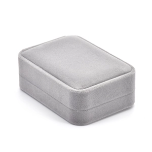 Detail of gray velvet jewelry gift box with minimalist rounded corners for rings