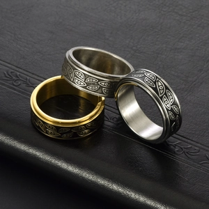 Three-piece stainless steel spinner rings for men featuring etched evil eye patterns
