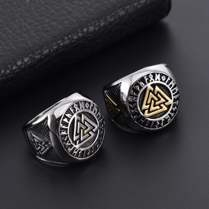 Macro shot of Viking Valknut rings with engraved Rune details and vintage steel finish