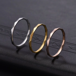 Three-piece stackable V-shaped geometric faceted rings in silver, gold, and rose gold