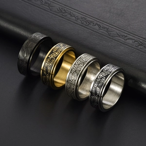 Punk style spinning evil eye rings in black, gold and silver stainless steel finishes