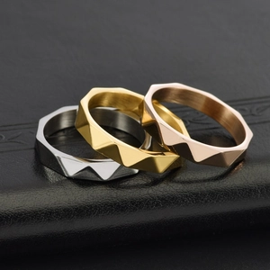 Three-color 18K gold geometric faceted 4mm cross rings in silver, gold, and rose gold