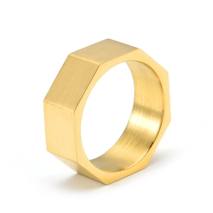 Macro detail of octagonal gold brushed titanium steel ring with polished inner surface