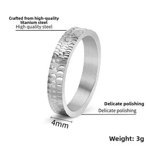 Detail view of 4mm silver titanium steel ring with textured scale pattern and 3g weight
