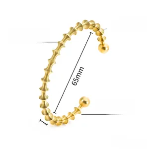 Macro view of gold spiral cuff bangle with dimension labels 65mm diameter and 6mm width