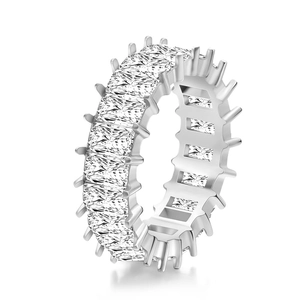 Eternity ring with emerald cut cubic zirconia in silver-tone claws on white background