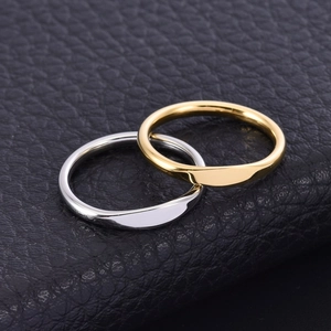 Macro shot of gold and silver twisted stackable minimalist stainless steel rings