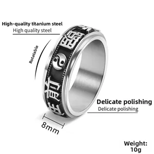Macro shot of 8mm rotatable stainless steel ring with yin yang and engraved characters