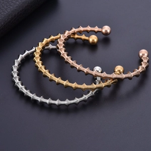 Three-piece spiral textured stainless steel open bangles in gold, silver, and rose gold