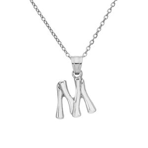 Macro detail of silver M letter pendant with bamboo texture on a fine steel chain