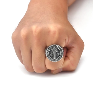 Detailed view of Saint Benedict Medal ring in vintage silver with embossed religious motifs