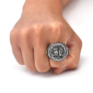 Macro detail of vintage Ancient Egyptian relief on a retro steel signet ring for men