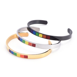 Rainbow C-shaped cuff bracelets in gold, silver, and black stainless steel three-piece set