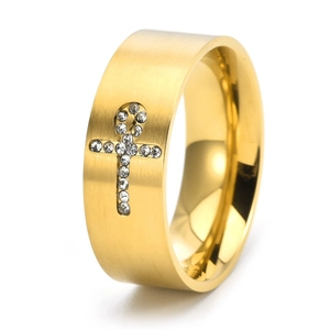 Detail of gold brushed stainless steel ring featuring a diamond-studded Ankh cross design