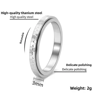 Detail showing 3mm width and 2g weight of the silver hammered texture spinning ring