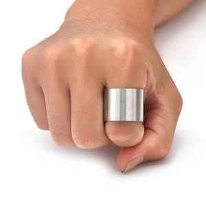 Close-up of 19mm wide brushed titanium steel ring worn on hand with industrial matte finish