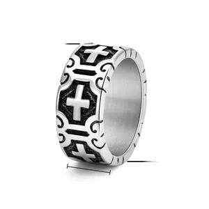 Detailed view of 10mm punk cross ring in vintage titanium steel with gothic engravings