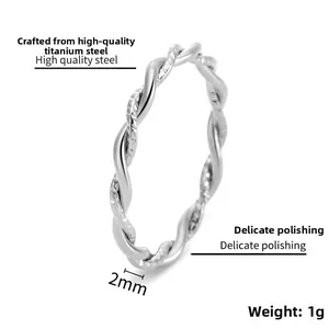Macro detail of 2mm silver twist rope ring showing high quality polished steel texture