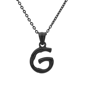 Detail of black polished bamboo-style letter G pendant on a fine link chain