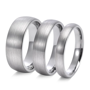Detailed view of silver tungsten rings with brushed matte finish in three widths