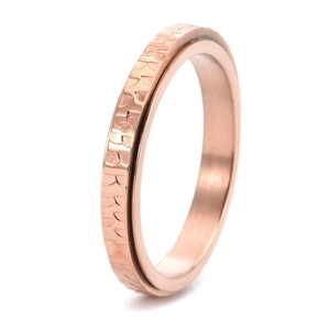 Detail of 3mm rose gold stainless steel ring with hammered texture and rotating design