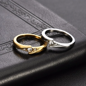 Polished stainless steel couple rings set with round zircon stones in gold and silver