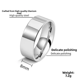 Macro view of 8mm wide polished titanium steel ring showing high mirror finish and weight