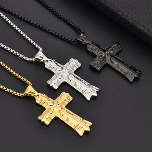 Three cross necklaces in gold, silver, and black finishes with embossed vintage details