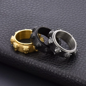 Vintage stainless steel spinning tiger head rings in gold, black, and silver punk style
