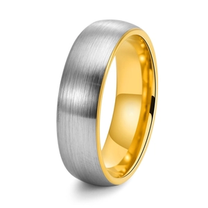 Detail of silver brushed surface and golden polished interior on a dual-tone tungsten ring