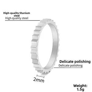 Detail of 2mm silver titanium steel gear ring showing industrial textured finish