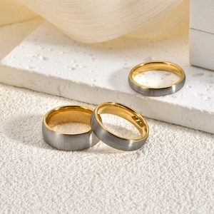 Minimalist brushed gray tungsten steel ring set with 18K gold plated inner band
