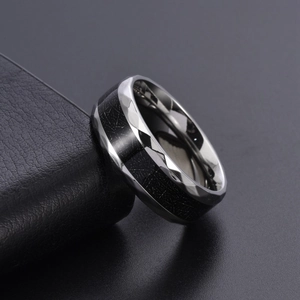 Men's titanium steel ring featuring black stone texture and faceted silver edges
