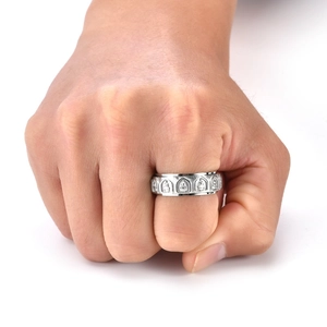 Detail of silver rotatable ring featuring relief carvings of 18 Arhats on wide band