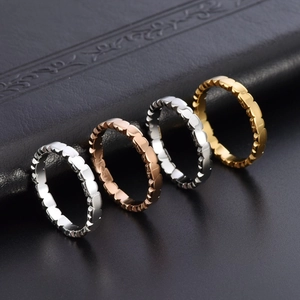 Polished minimalist stainless steel heart-shaped rings in silver, gold, and rose gold