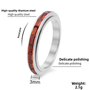Close-up of 3mm spinning titanium steel ring with red rectangular zircon stones