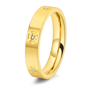 Detail showing 18K gold-plated titanium steel ring with embossed cross patterns and zircons