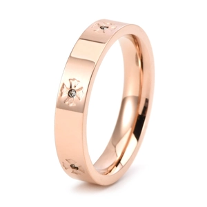 Detail of rose gold titanium steel ring with cross patterns and inset zircon stones