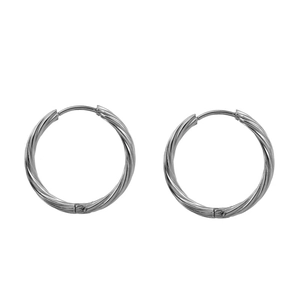 Detailed close-up of twisted hoop earrings made of silver stainless steel on white