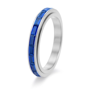 Macro shot of silver spinner ring with channel-set rectangular blue zircon gemstones